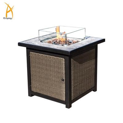 China Stocked Fire Pit Table Rattan Garden Fire Table With Wind Glass Guard for sale