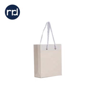 China RR Donnelley Recyclable Wholesale Kraft Paper Bag Eco Gift Shopping Bag With Customized Printing Logo for sale