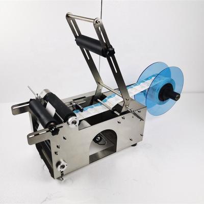 China Portable Manual Beverage Bottle Labeler Semi Automatic Sticker Labeling Machine for sale