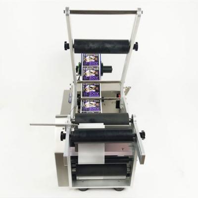 China Beverage Mini Manual Paste Food Industrial Hand Rolling Labeling Machine for sale