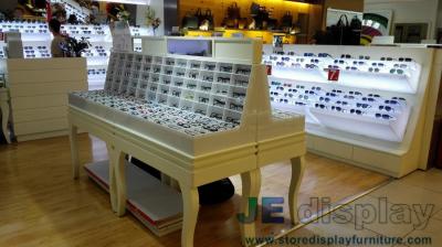 China Eyeglass display case Optical store interior design by Wall eyeglass display cabinets in Black with White glossy Couters for sale