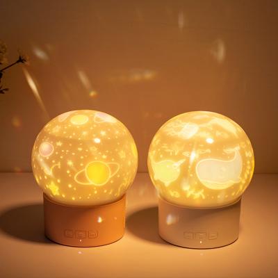 China Modern BT Style DIY Projector Starry Sky Moon USB Rotating Lamp with Projection Music for Kid's Gift Home Decoration LED Night Light for sale