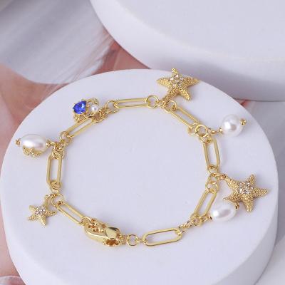 China 2022 TRENDY Trendy Minimalist Jewelry Gold Plated Alloy Brass Bracelet With Pearl Kate Crab Starfish Chain Link Women Bracelet Shovel for sale