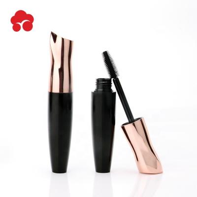 China Fashionable 15ml Customized Round Shapes Gold Cover Mascara Tube With Black Brush for sale