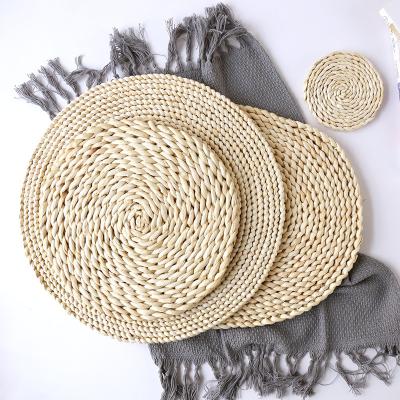 China Viable Kitchen Dining Table Mat Insulation Round Corn Straw Braided Place Mat for sale