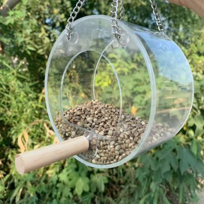 China Good Quality Outdoor Round Bird Feeders Viable Transparent Acrylic Parrot Birds Anti-sprinkling Food Box Bird Hanging Feeder for sale