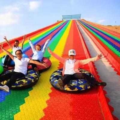 Cina Theme Park Colorful Dry Slide Kids Plastic Rainbow Slide For Sale in vendita