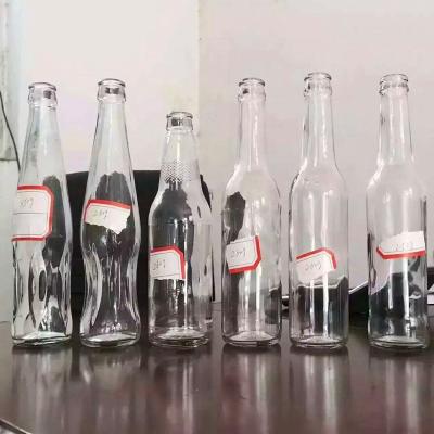 China Customized Beverage China Manufacturer 250ml 330ml 500ml Clear Beverage Soda Glass Bottle Glass Bottle Juice Bottle for sale