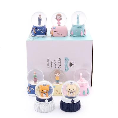 China Europe Resin Crystal Ball Doll With Lamp Household Ornaments Wholesale Christmas Snow Globe Gifts For Friends for sale