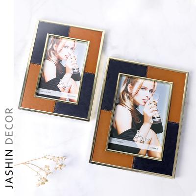 China Modern Luxury High Quality Desktop Metal Picture Frame Decorative Creative Leather Picture Frame for sale