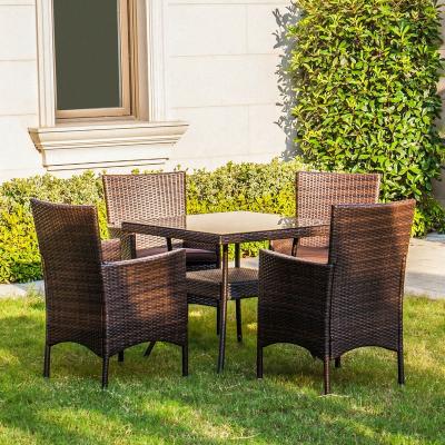 China Latest Style Outdoor Durable Glass Rattan Table Patio Furniture With Four Or Six Chairs for sale