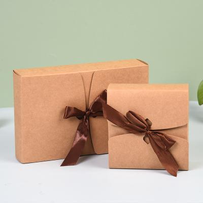 China Recyclable Hot Sale Bow Bandage Hand Gift Wedding Candy Box Wrapping Paper Ornament Perfume Tea Folding Gift Box for sale