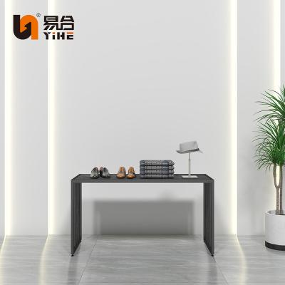 China Customized mall retail store clothing store, island table display stand high and low black display table for sale