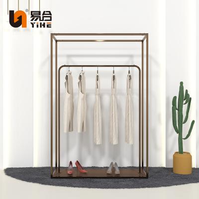 China Customized Women Clothing Store Luxury Pretty Gold Clothes Display Racks For Clothing Store for sale