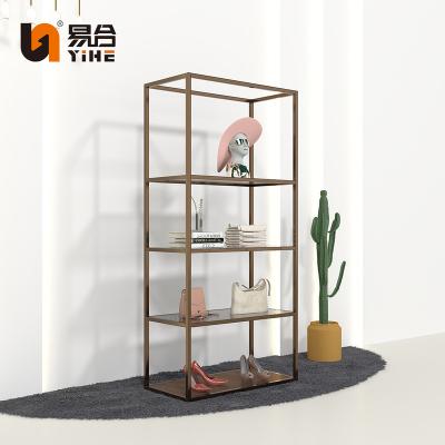 China Customized Luxury Modern Boutique Metal Retail Heavy Duty Gold Garment Display Rack Furniture Clothing Rack With Shelves for sale