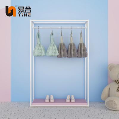 China Customized Baby Clothes Store Shelves Display Rack Metal Clothing Storage Rack Pink Design Kids Display Stand for sale