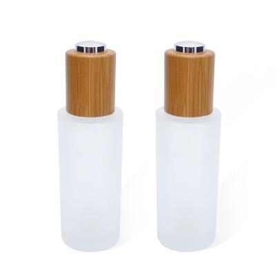 China Non Spill Push Button 20 410 Bamboo Dropper For Frosted Glass Bottle for sale