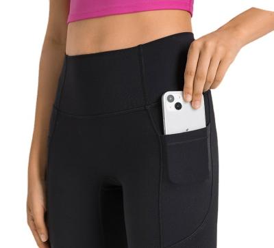 China Breathable DL341 yoga leggings with pockets for women leggings with side phone pockets high waist athletic yoga for sale