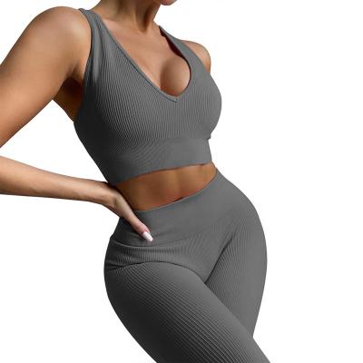 China Breathable YJ111 two pcs yoga outfit ribbed fabric racer back sports bra and leggings seamless tracksuit sets for women for sale