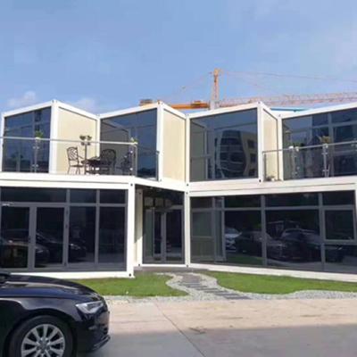 China Eco-friendly Metal Houses Construction Sandwich Panel Steel Frame Prefab Steel Construction Warehouse Building for sale