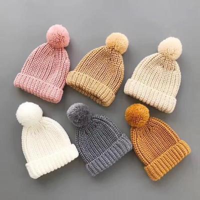 China SHUMON Kids Girls New Shape Design Fleece Striped Winter COMMON Rib Knitted Pompom Beanie Hat With Faux Fur Pom Pom for sale