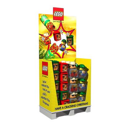 China Advertising Snacks Vend Floor Display Rack Yellow Man Small Paper Toys Cardboard Floor Display Stand For Store for sale