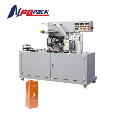 China Food overwrapping machine film packing machine condom packing machine for sale