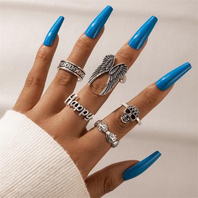 China Environmental Friendly Customized English Letter Ring Set Wing Shape Silver Plated Ring 5 Pieces Set Couples Ring for sale