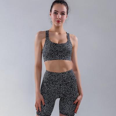 China POLYESTER / NYLON Amazon Yoga Bodysuit Popular Women's Yoga Clothes Popular Hollow Back Wave Stitch Sports Shorts Set for sale