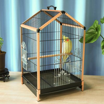 China Best Selling Breathable Ornamental Triangular Parrot Cage Starling Bird Cage Insulated Iron for sale