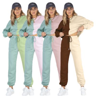 China Winter Breathable Pure Color Tracksuit Women Symmetrical Spliced ​​Sweatshirt And Tracksuit Set Casual Long Sleeve Round Neck And Sweatpants Set for sale