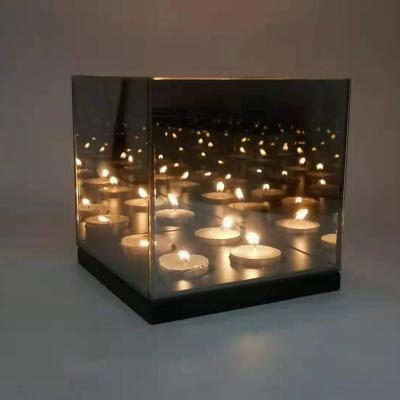 China Infinity Cube Home Decoration 15x15CM Glass Tealight Candle Holder With 4 Candle Reflective Tealight Candle Holder for sale