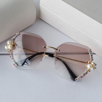 China Fashion Sunglasses Manufacturers Custom Colors Diamond Oversized Rimless Sunglasses For Men And Women for sale