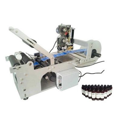 China Newest good quality bottle labeling machine, round bottle sticker with date coder for sale