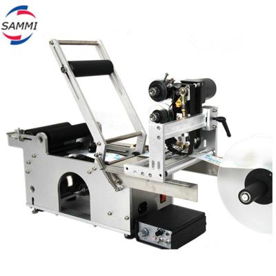 Cina High precise self-adhesive sticker label machine with date printer for round bottles in vendita