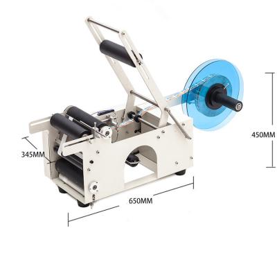 Cina Tabletop manual sticker labeling machine , adhesive labeling machine for round bottle in vendita