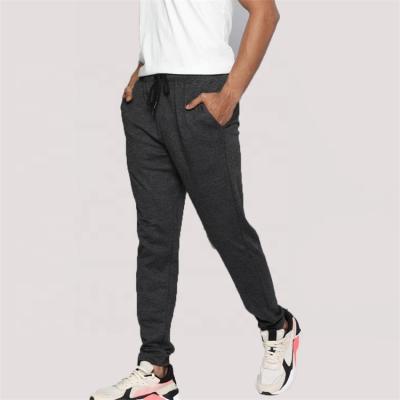 China Custom Anti-wrinkle OEM casual sweatpants draw string polyester gym joggers sport tracksuit for men for sale