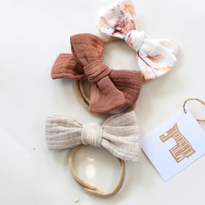 China OEM Service China Manufacturer Kids Hair Accessories Chiffon Elastic Nylon Handmade Cloth Tied Bow Headbands For Babies for sale