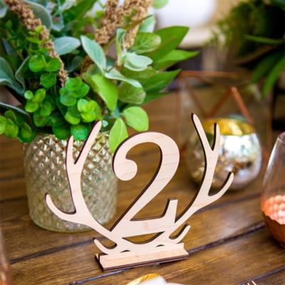 China New Design Wooden Party Supplies Hollow Deer Number Seat Place Holder Table Number For Wedding for sale