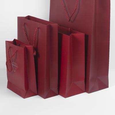 China Custom Retail Bulk Luxury Paper Bags Recyclable With Your Own Logo Design White Paper Cheap Gift Packaging Suitcase for sale