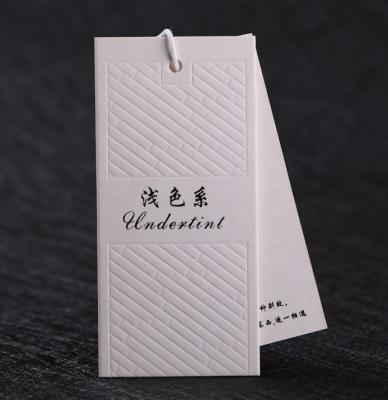 China Custom swing hang tags paper tag designs clothing garment pant logo tag for sale