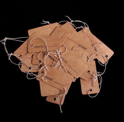 China Recycled Kraft Cardboard Hang Tag Paper Swing Clothing Hang Tags For clothing for sale