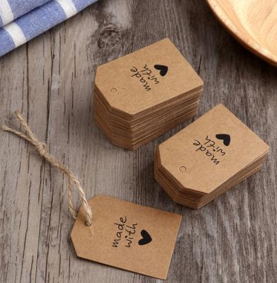 China Custom Hangtags Recycled Brown Kraft Paper Hang Tag Kraft Cardboard Paper Hang Tag For Garment for sale