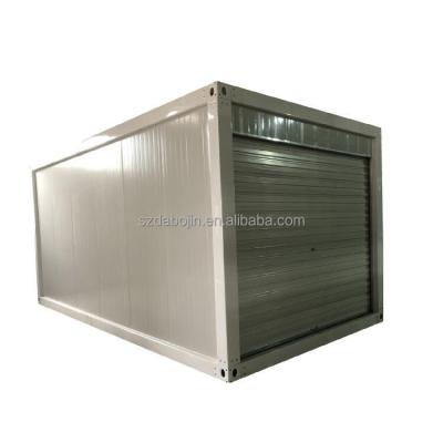 China Modern Shipping Prefab Flat Pack Container House Shop Storage Warehouse With Roller Shutter Roll Up Door for sale