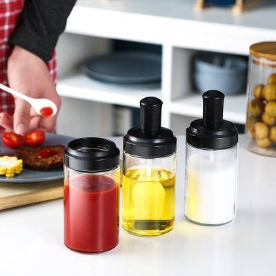 China Fashionable New Style Transparent Glass Seasoning Container Bottle Seasoning Bottle Set With Spoon Cap for sale