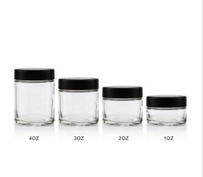 China 1oz 2oz 3oz 4oz Food Custom Sizes Clear Glass Jars For Dried Food Nuts Flower With Black Lid for sale