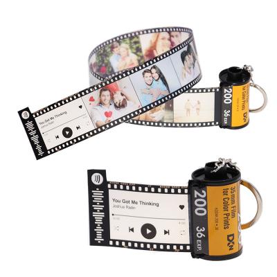 China Leather Personalized Keychains With Custom 10 Photo Camera Film Roll Key Chain for sale