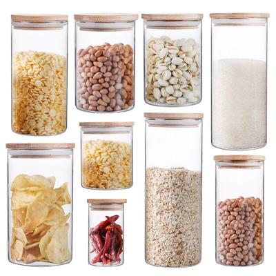 China Sustainable YOYO Tall Clear Airtight Food Storage Canister with Sealing Wood Cover for NoodlesSugar Tea Coffee Glass storage Jars for sale