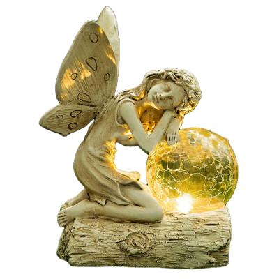 China Solar Resin Angel With Glass Light Outdoor Angel Crafts Artificial Garden LED Angel Sleep Light for sale