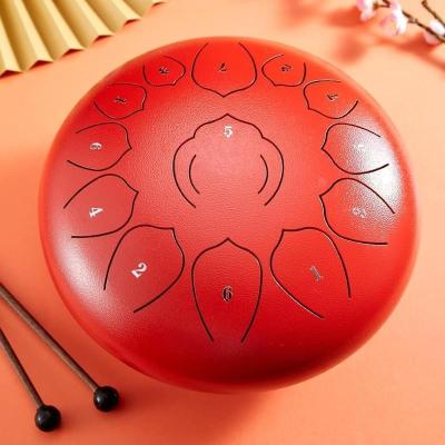 China Meditation yoga zen color new 12 inch alloy steel tongue drum handpan drum 13 notes for sale